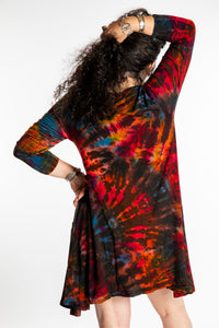 Susan wearing a long sleeve tie dye dress in the color Brown
