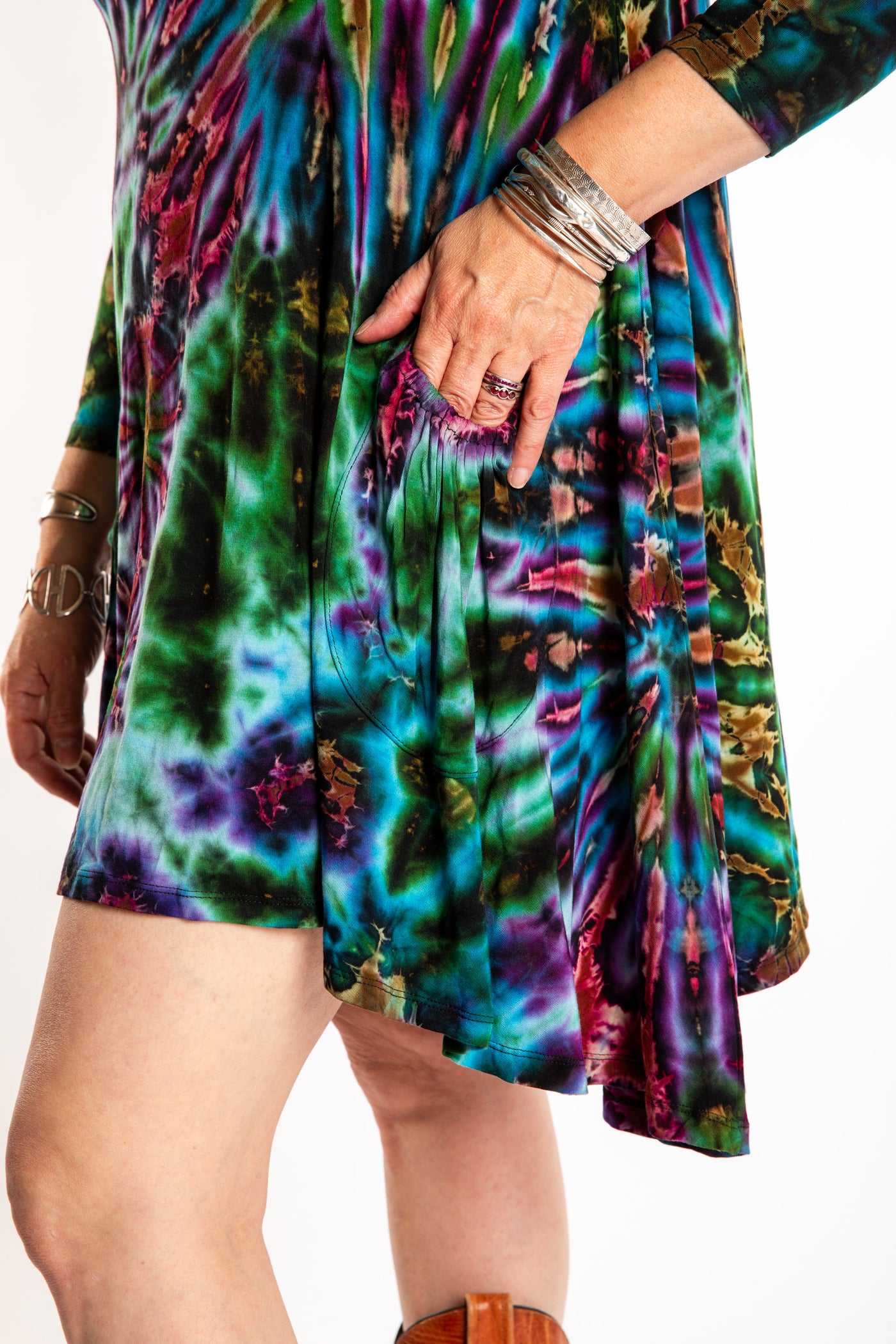 Susan wearing a blue long sleeve tie dye dress in the color Ocean