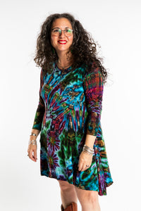 Susan wearing a blue long sleeve tie dye dress in the color Ocean