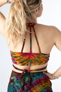 Sophie is wearing a tie dye wrap top in green 
