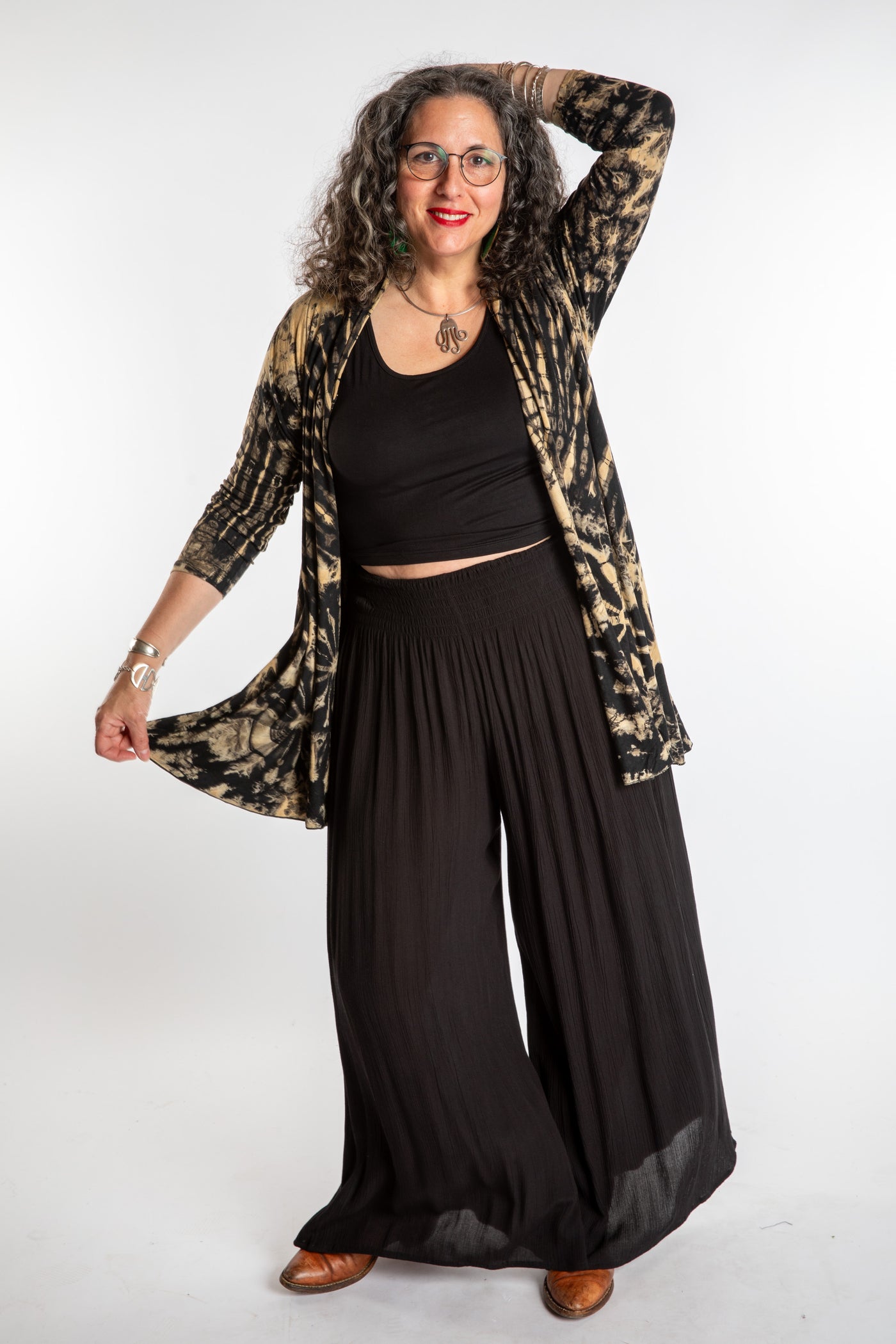 Susan wearing a black and white mudmee tie dye cardigan
