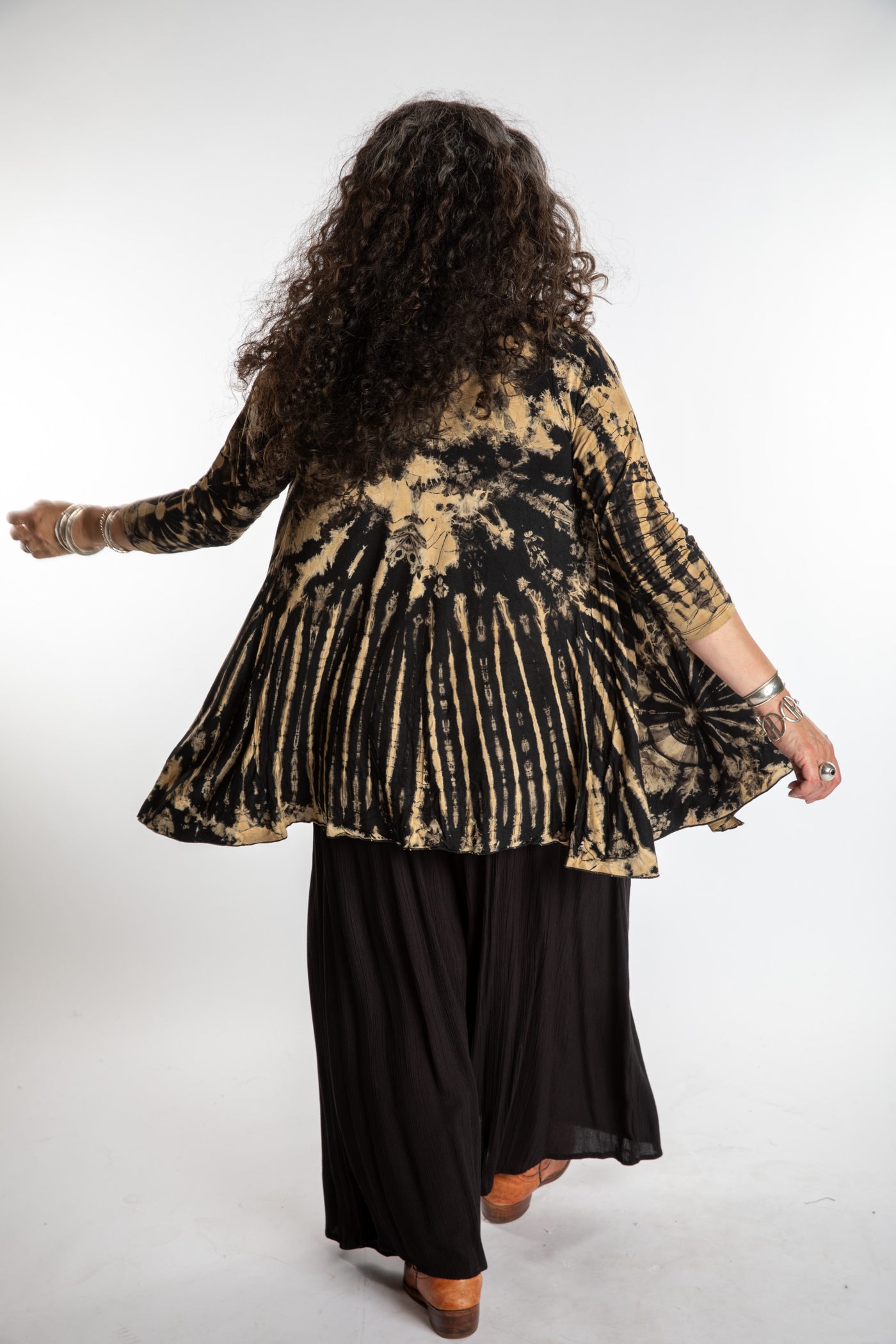 Susan wearing a black and white mudmee tie dye cardigan
