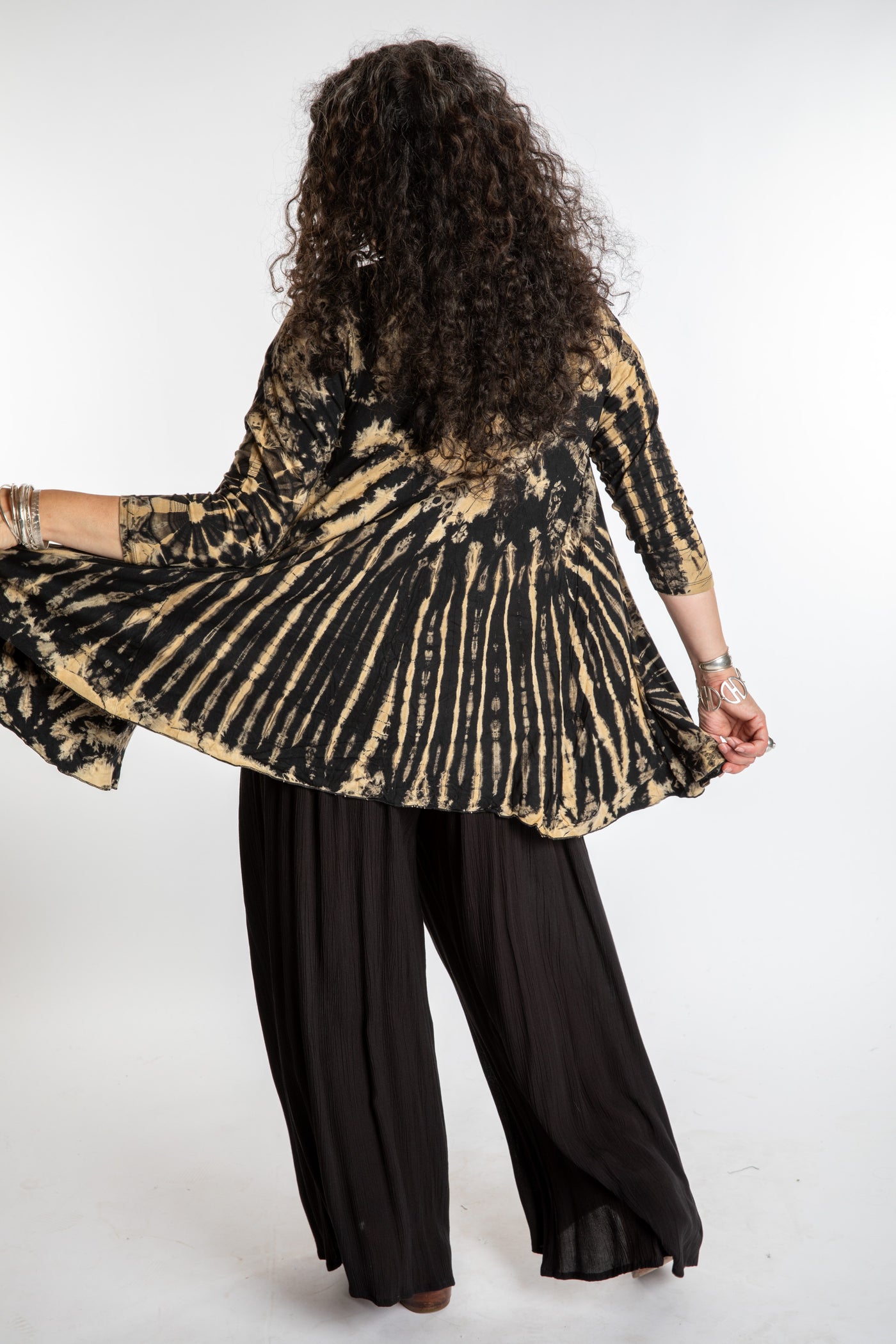 Susan wearing a black and white mudmee tie dye cardigan