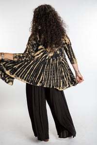 Susan wearing a black and white mudmee tie dye cardigan