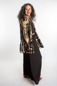 Susan wearing a black and white mudmee tie dye cardigan