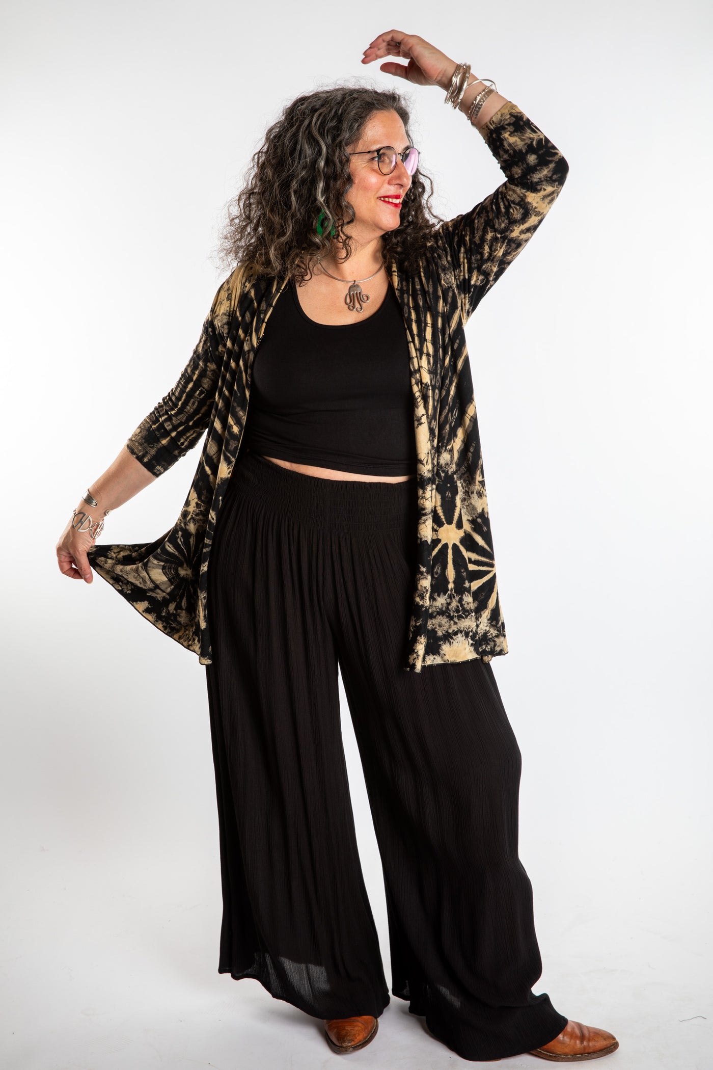Susan wearing a black and white mudmee tie dye cardigan