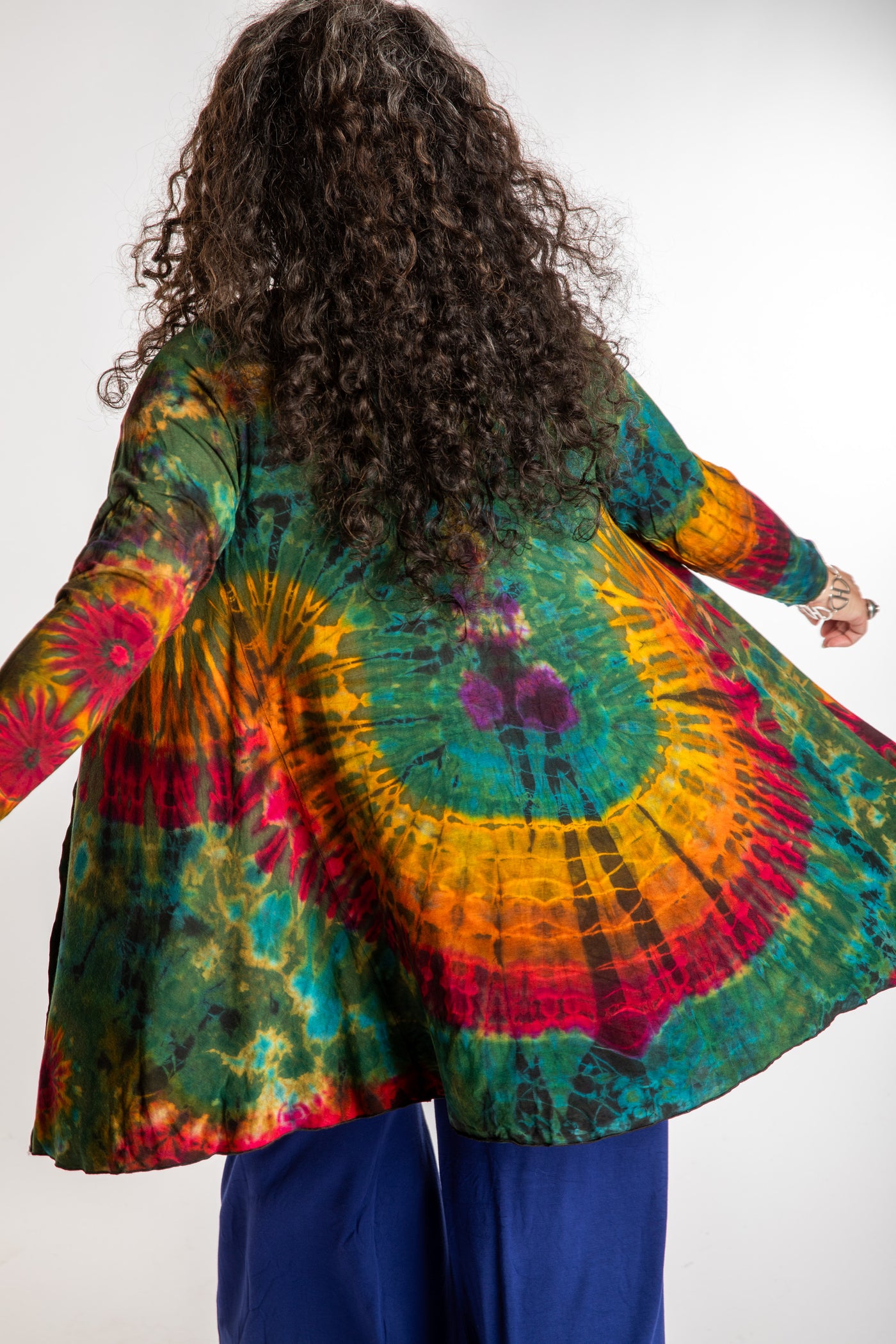 Susan wearing a green mudmee tie dye cardigan