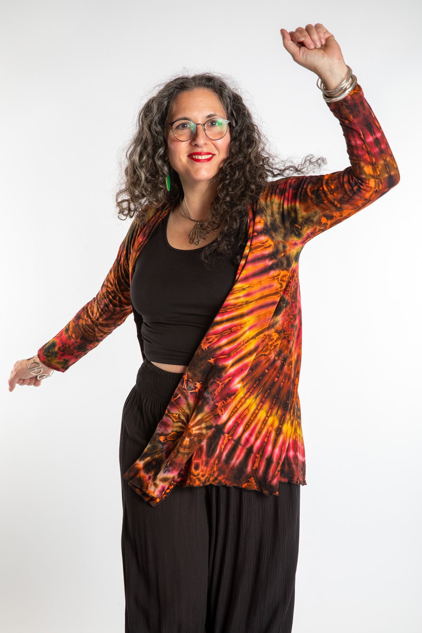 Susan wearing a orange sunset mudmee tie dye cardigan