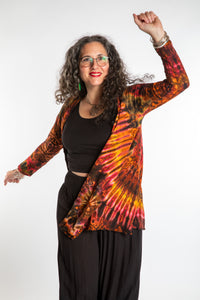 Susan wearing a orange sunset mudmee tie dye cardigan