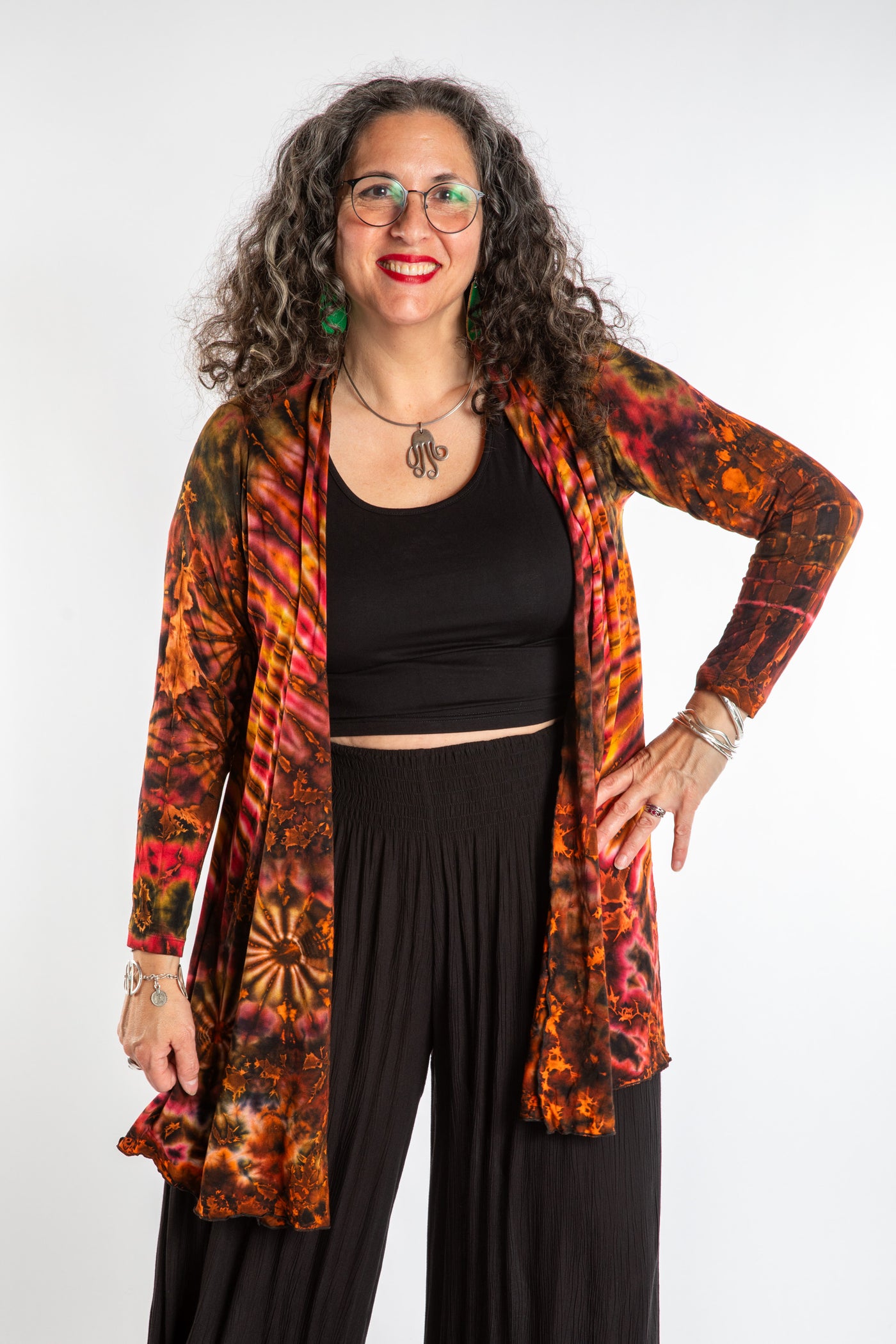 Susan wearing a orange sunset mudmee tie dye cardigan
