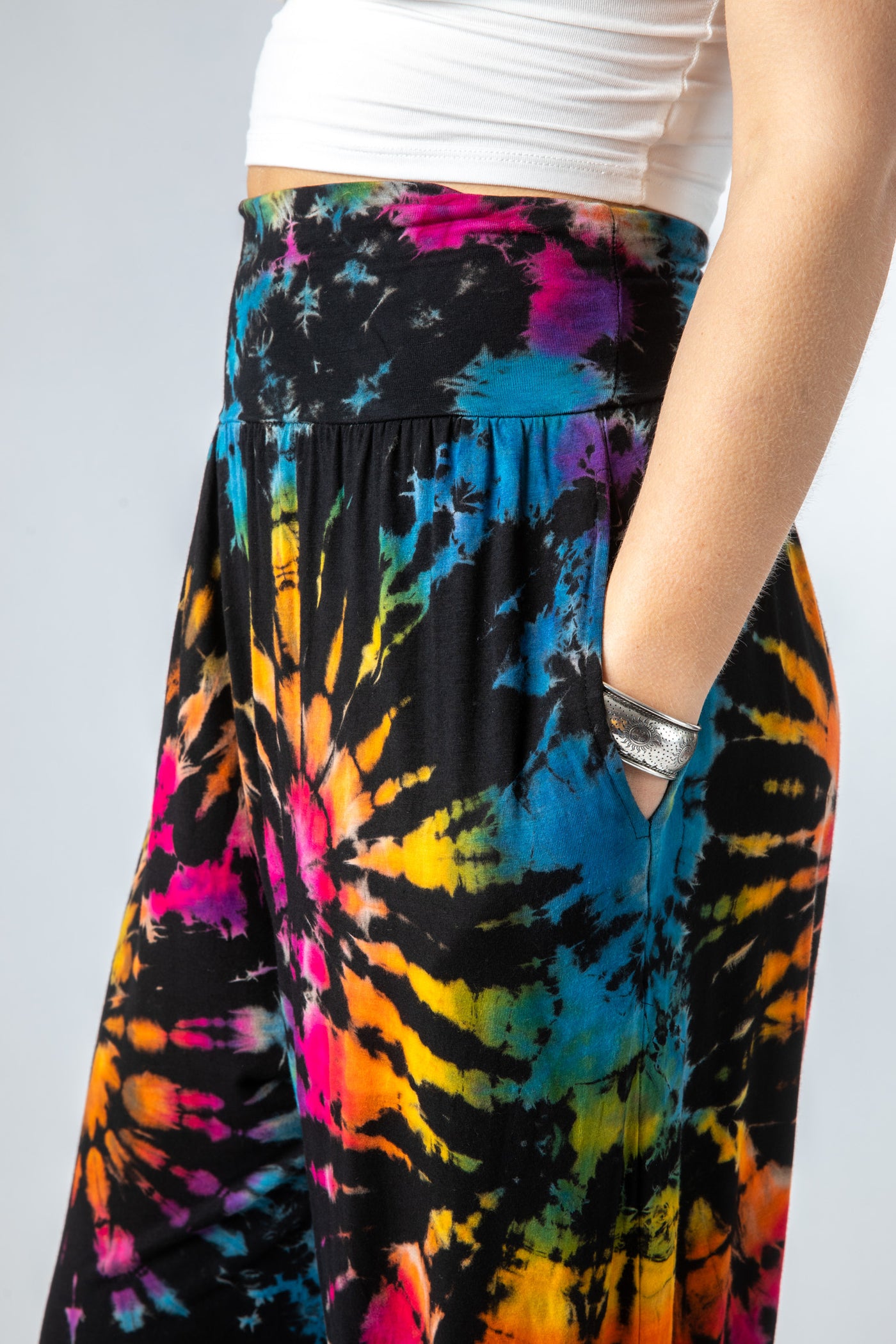 Sophie is wearing size S/M tie dye harem pants in black rainbow 