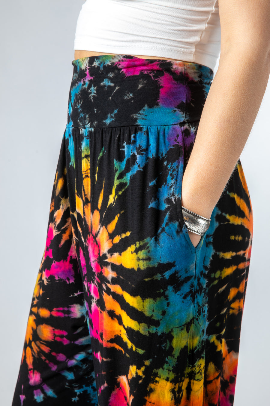 Sophie is wearing size S/M tie dye harem pants in black rainbow 