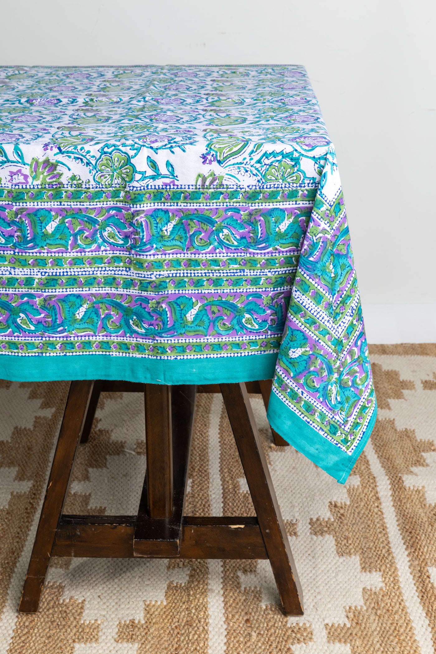 Bohemian block print tapestry in Drifting Blossoms, displayed as tablecloth