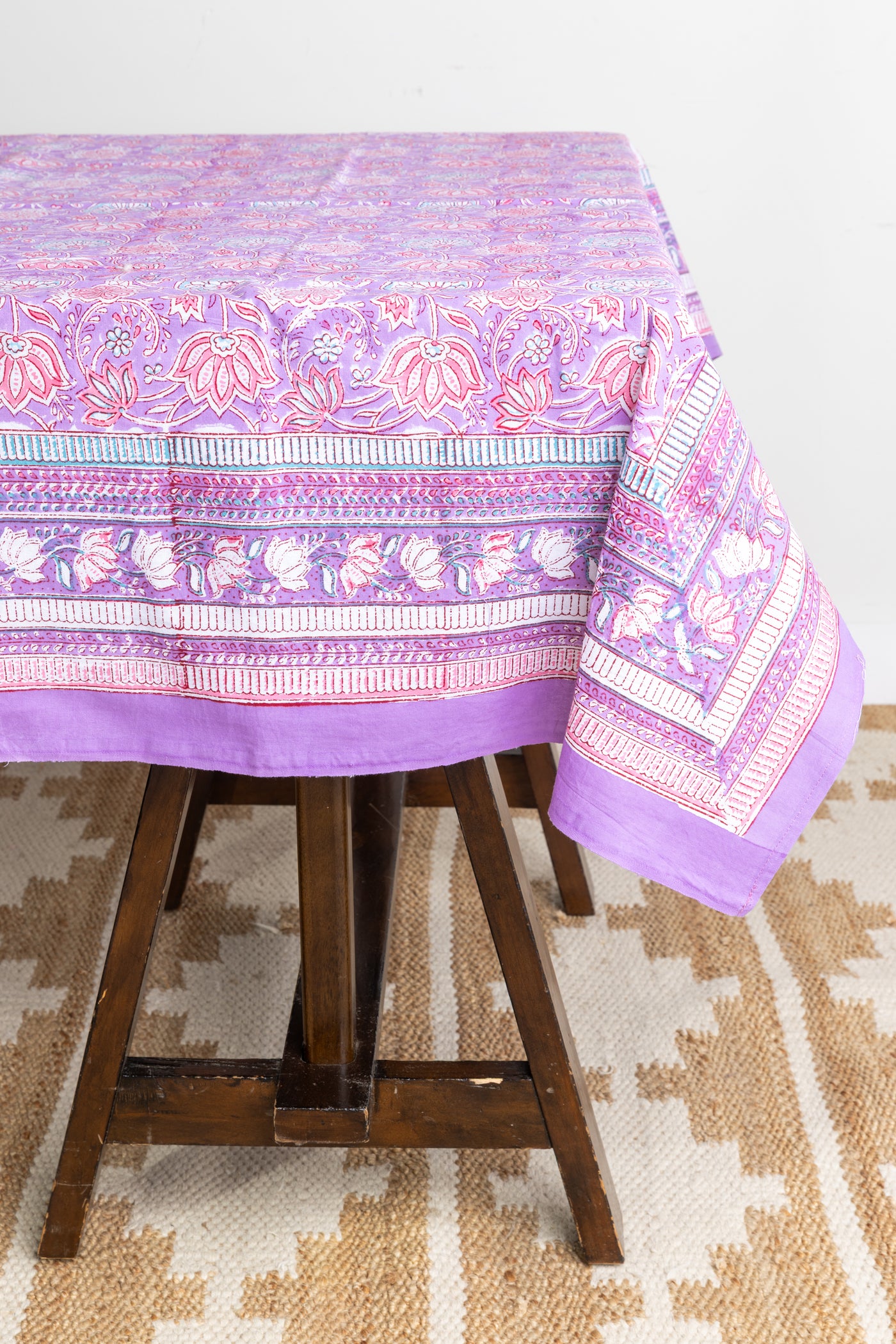 Bohemian block print tapestry in Lavender Floral, displayed as a tablecloth