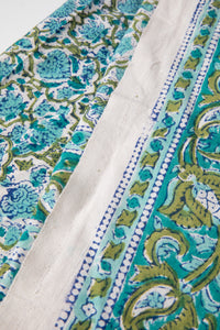 Bohemian block print tapestry in Blue Posie, folded on white background