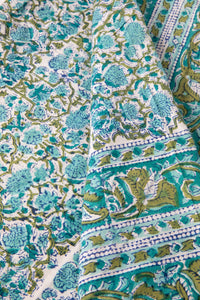 Bohemian block print tapestry in Blue Posie, folded on white background