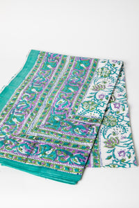 Bohemian block print tapestry in Drifting Blossoms, folded on white background