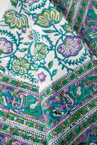 Bohemian block print tapestry in Drifting Blossoms, folded on white background