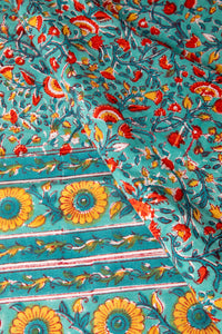 Bohemian block print tapestry in Mediterranean Oasis, folded on white background