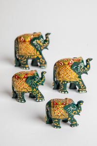 Wooden hand painted elephant family in green