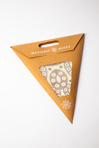 Creme embroidered paper star, folded up, in packaging