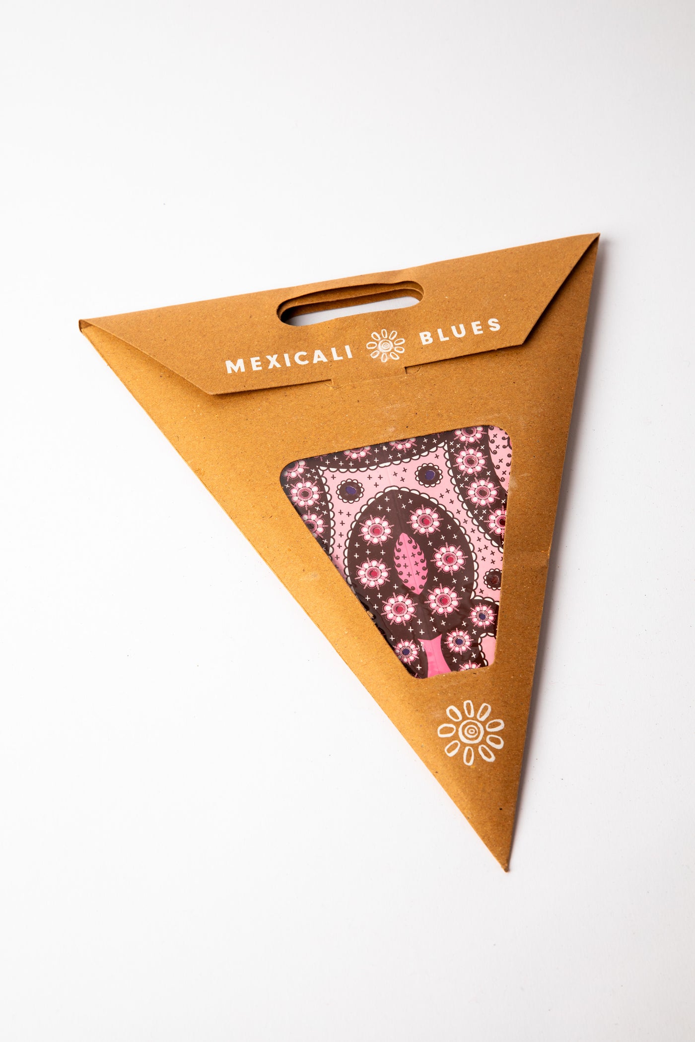 Pink embroidered paper star, folded up, in packaging