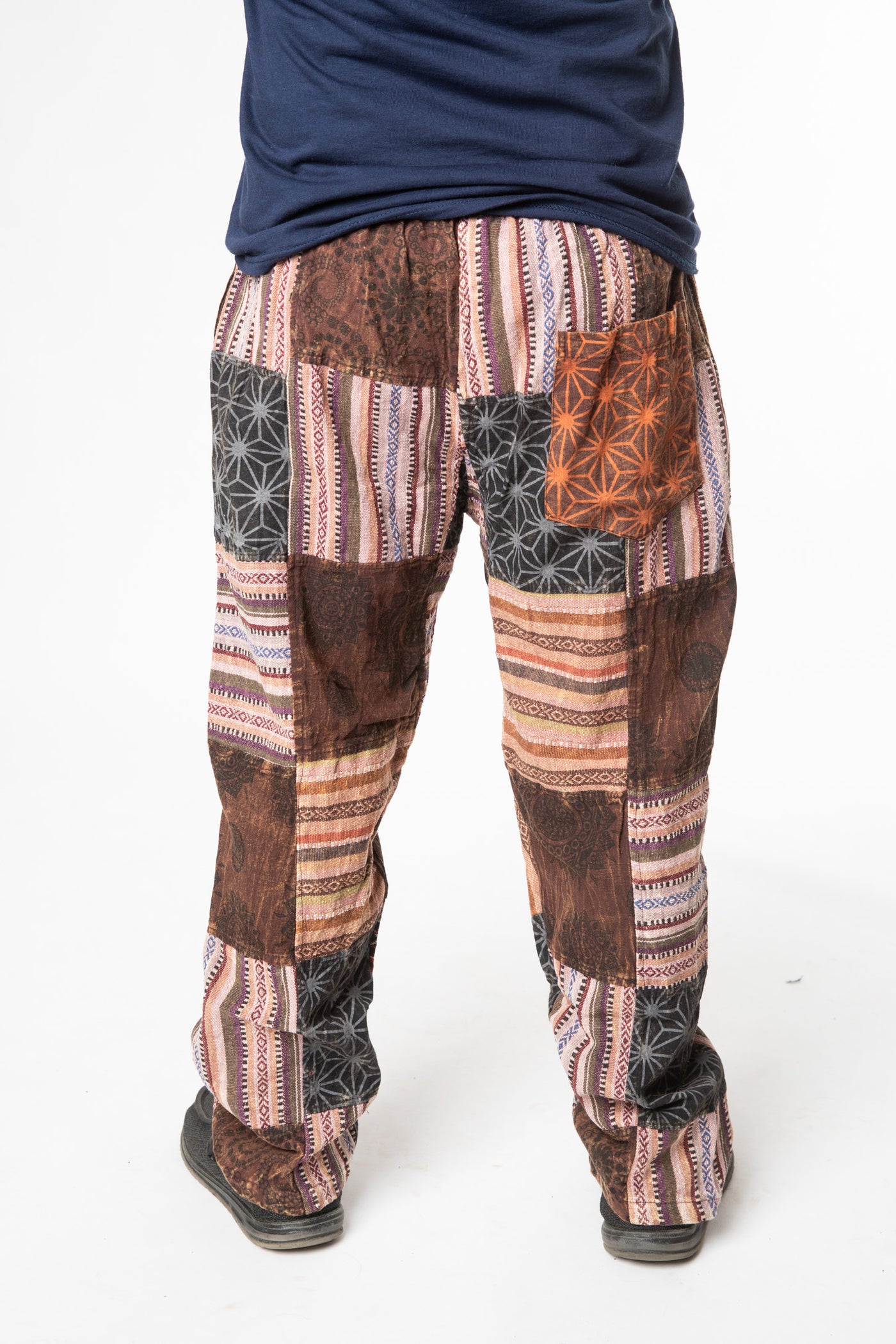 Harvey is wearing size M patchwork pants in brown 