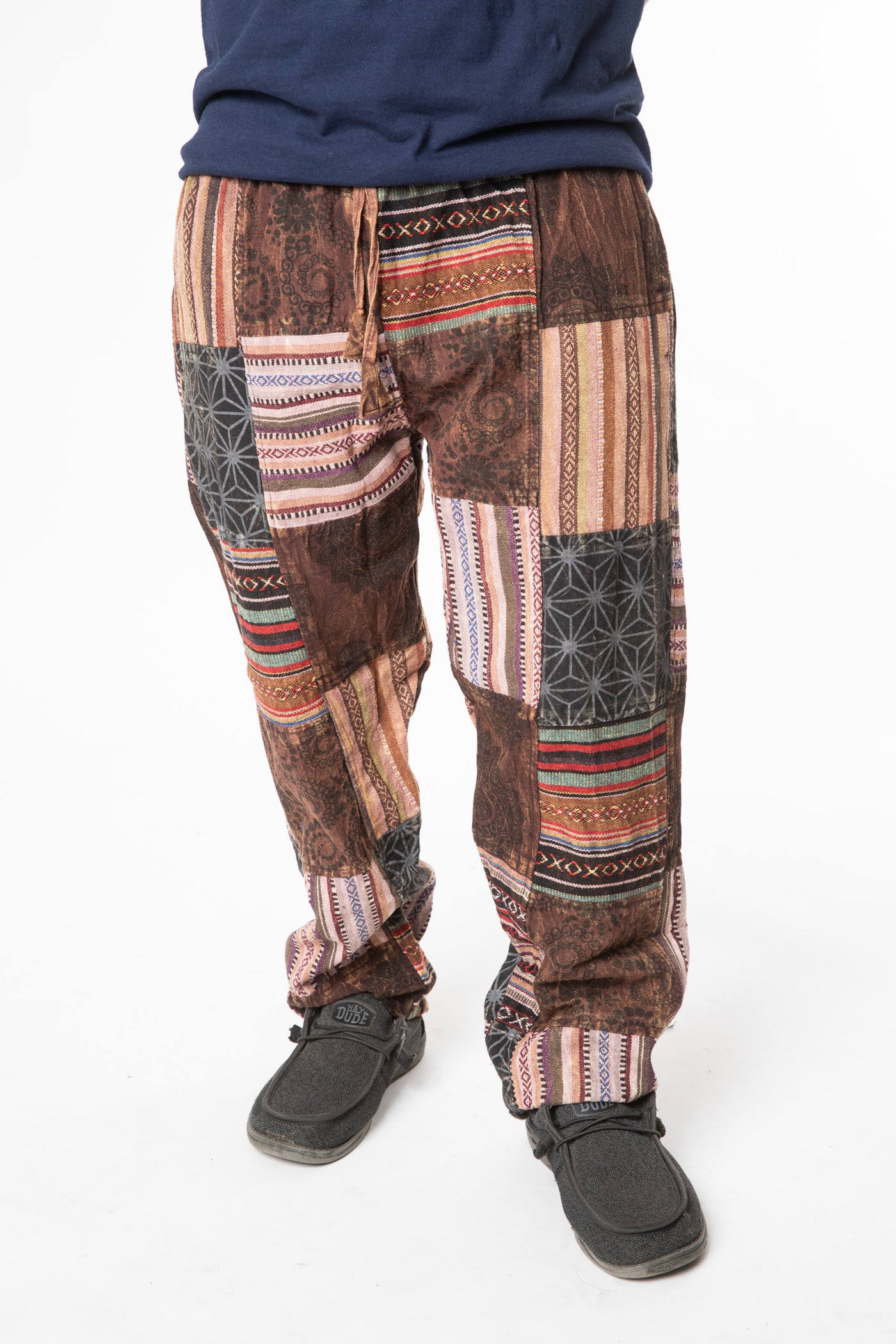 Harvey is wearing size M patchwork pants in brown 