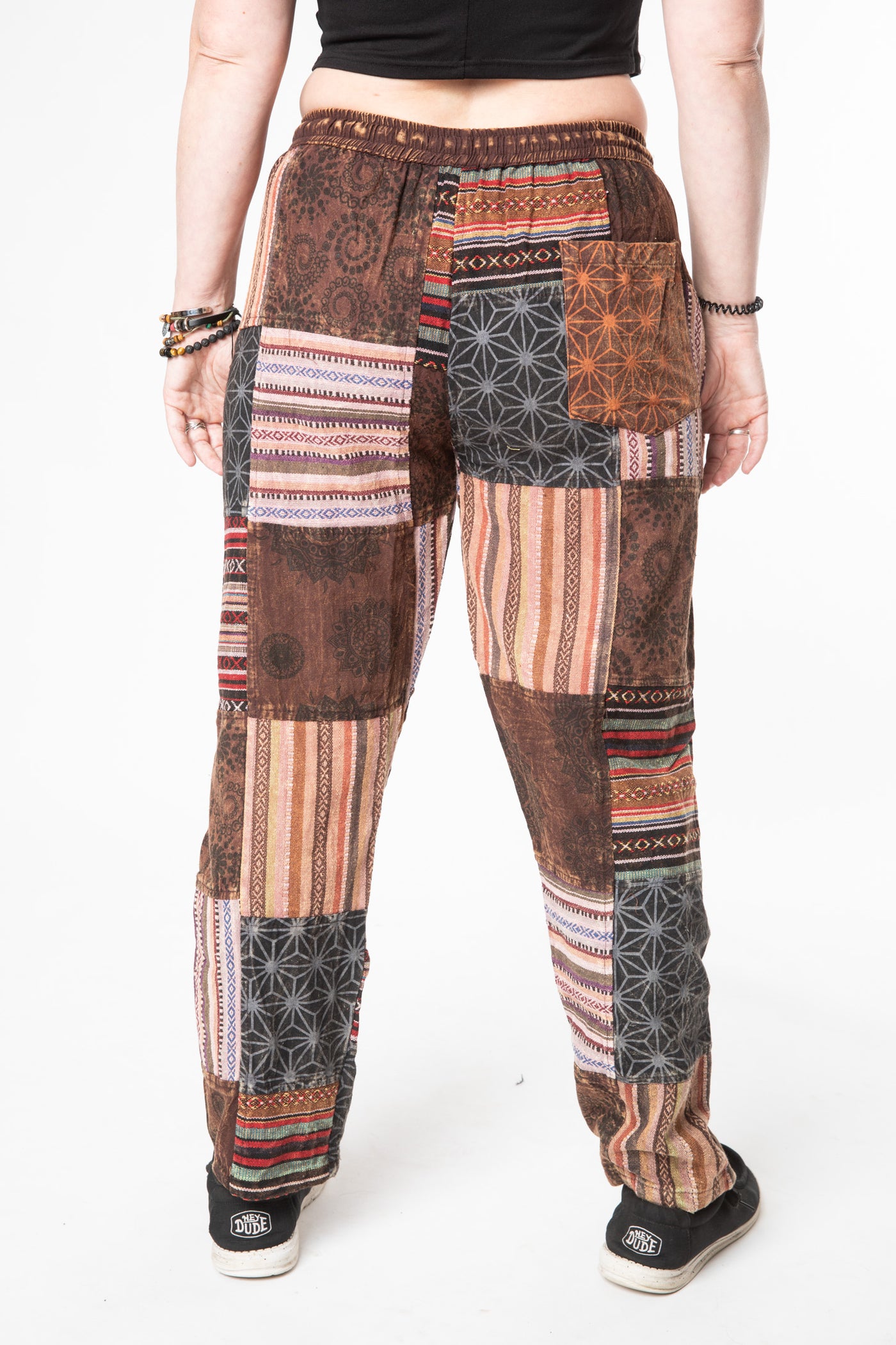 Margaret is wearing size M patchwork pants in brown 