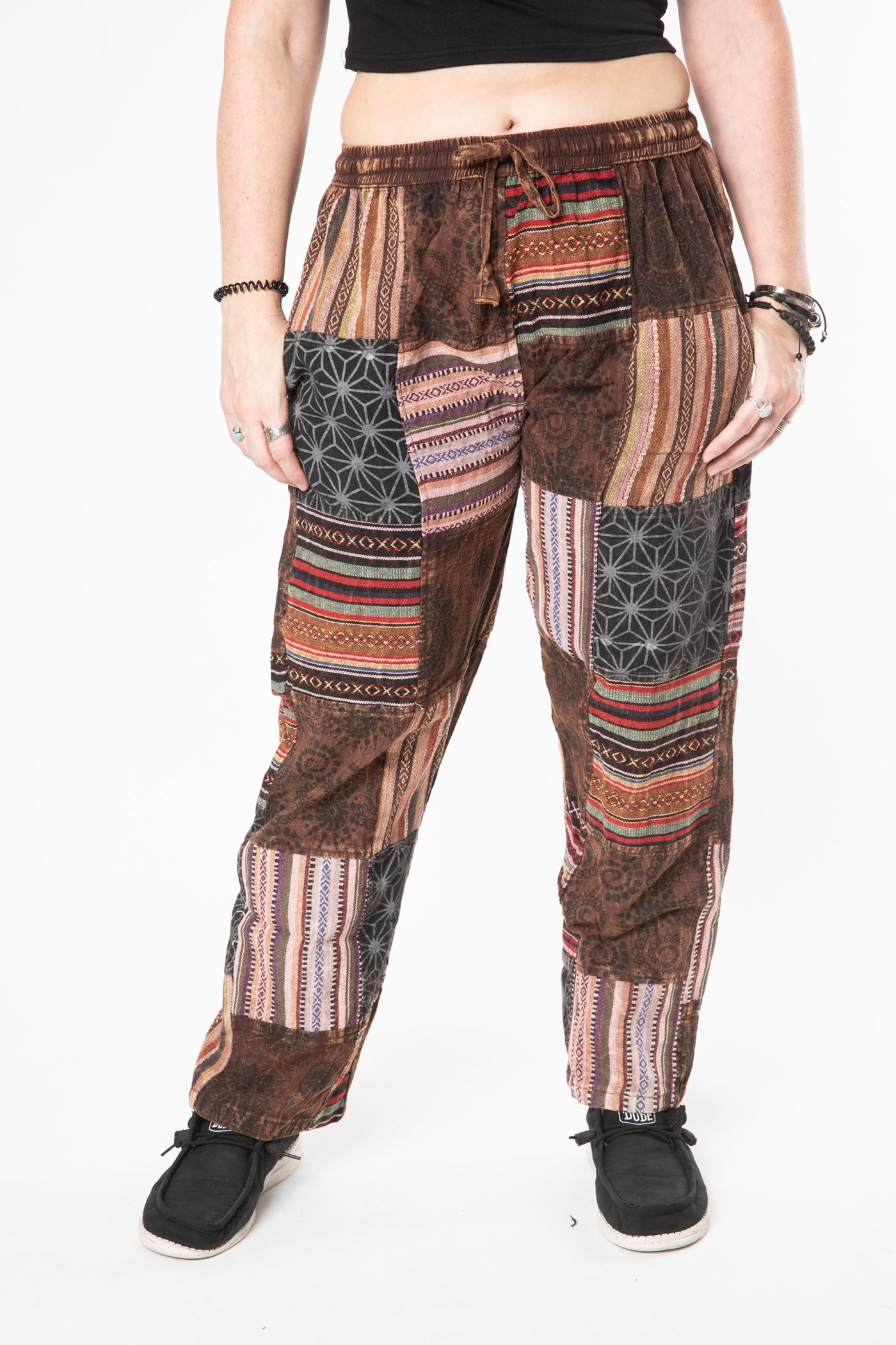 Margaret is wearing size M patchwork pants in brown 