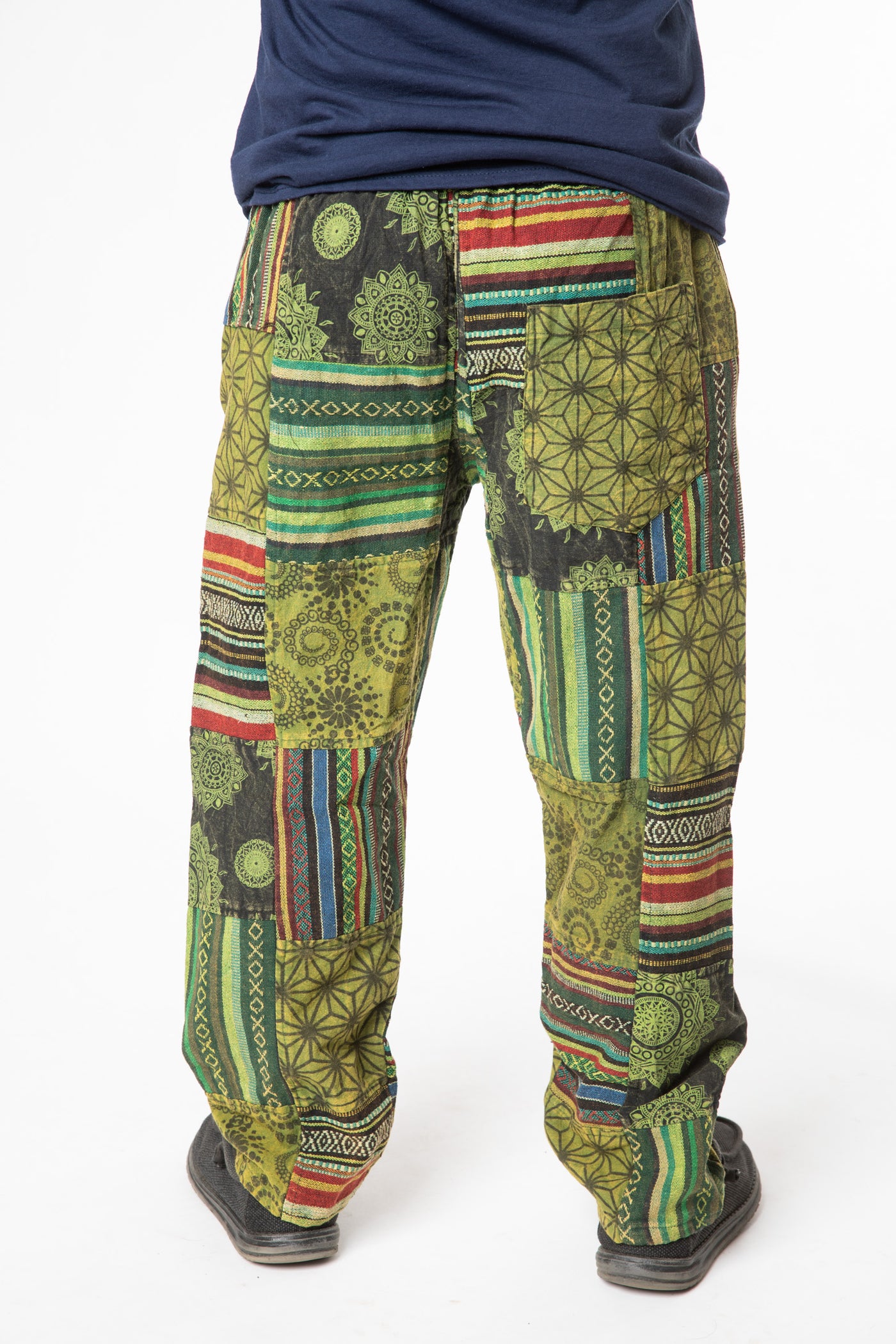 Harvey is wearing size M patchwork pants in green 
