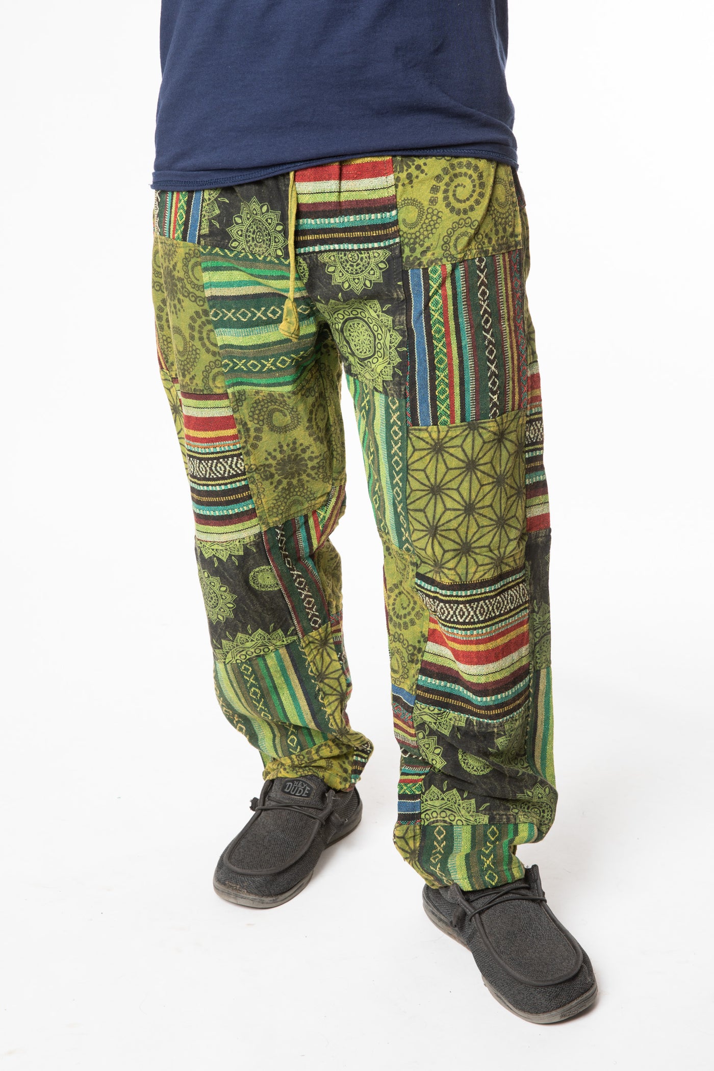 Harvey is wearing size M patchwork pants in green 