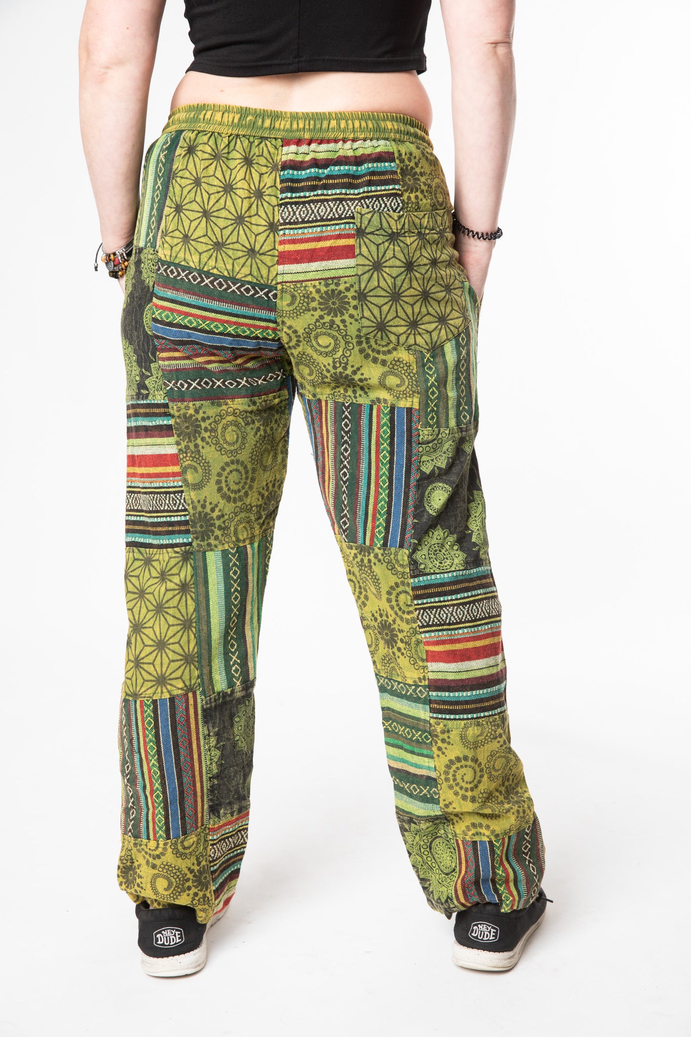 Margaret is wearing size M patchwork pants in green 