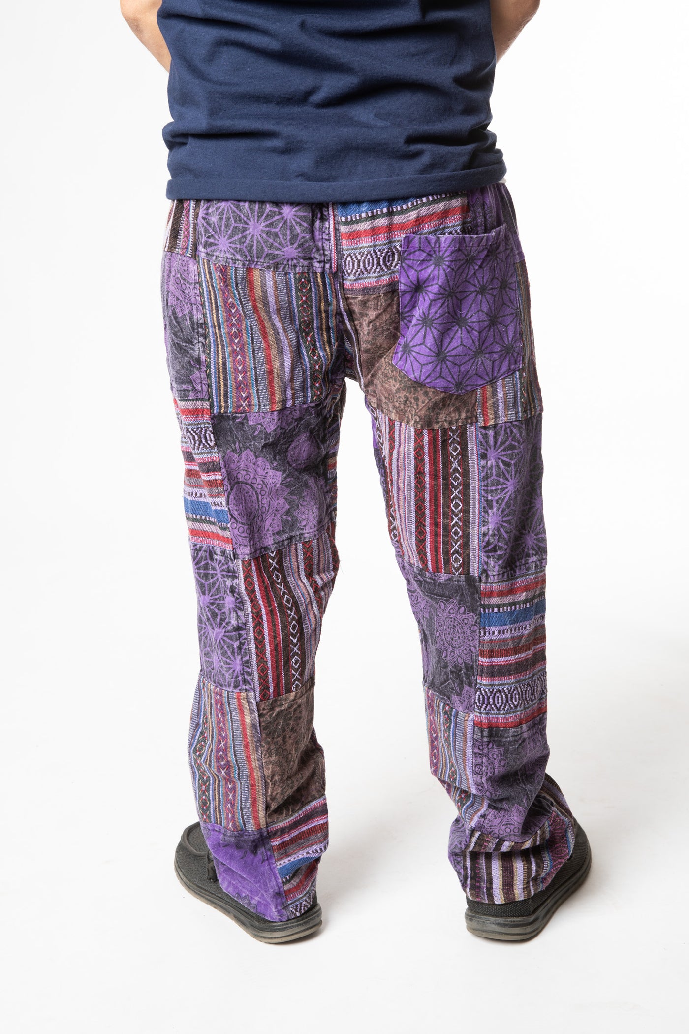 Harvey is wearing size M patchwork pants in purple 
