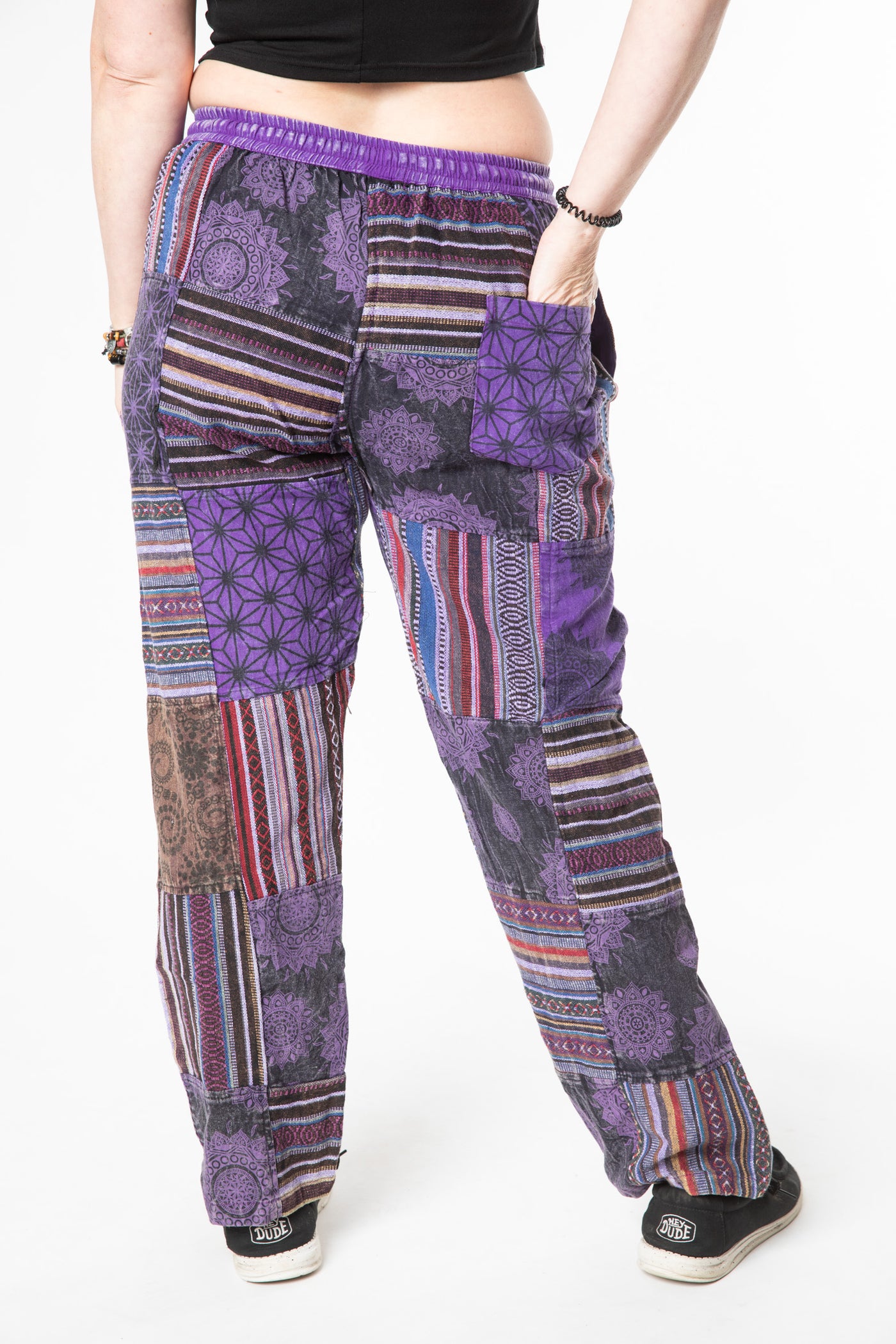 Margaret is wearing size M patchwork pants in purple 