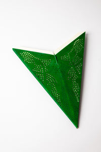 Green dotted embroidered paper star folded up, out of the package