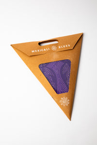 Purple dotted embroidered paper star, folded up, in packaging