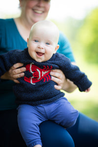 Ben wearing size 3 Lobster Baby Sweater in Navy