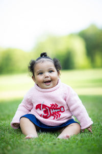 Moon wearing size 3 Lobster Baby Sweater in Pink