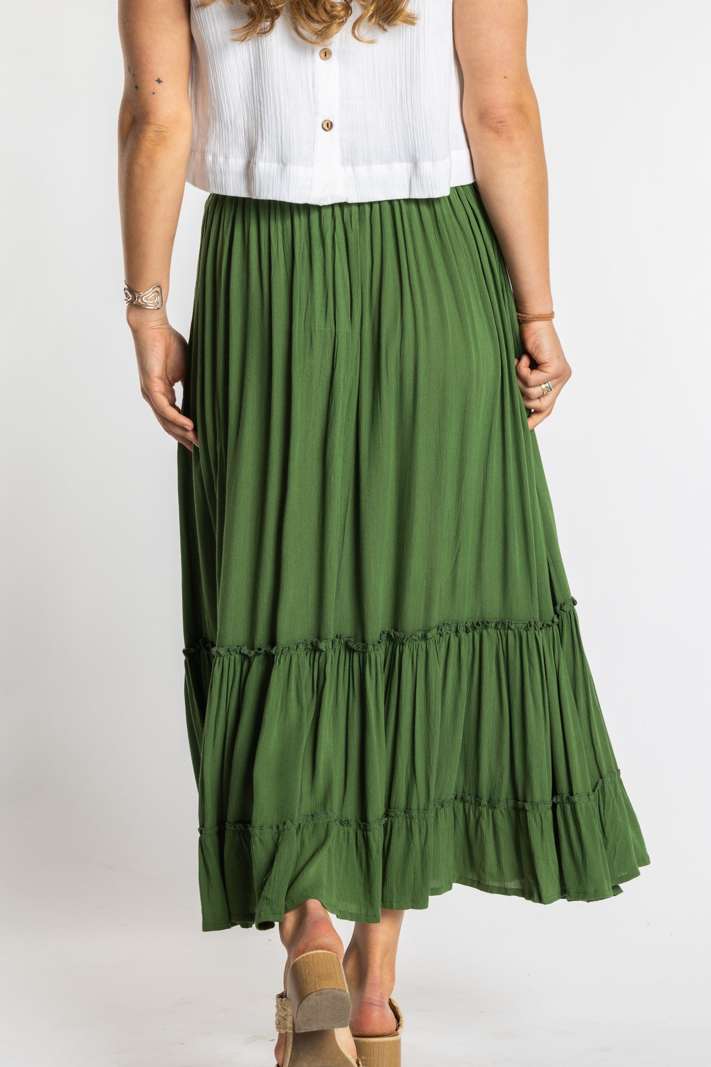 Sophie is wearing the Breezy Bliss Boho Prairie Skirt in green Fern