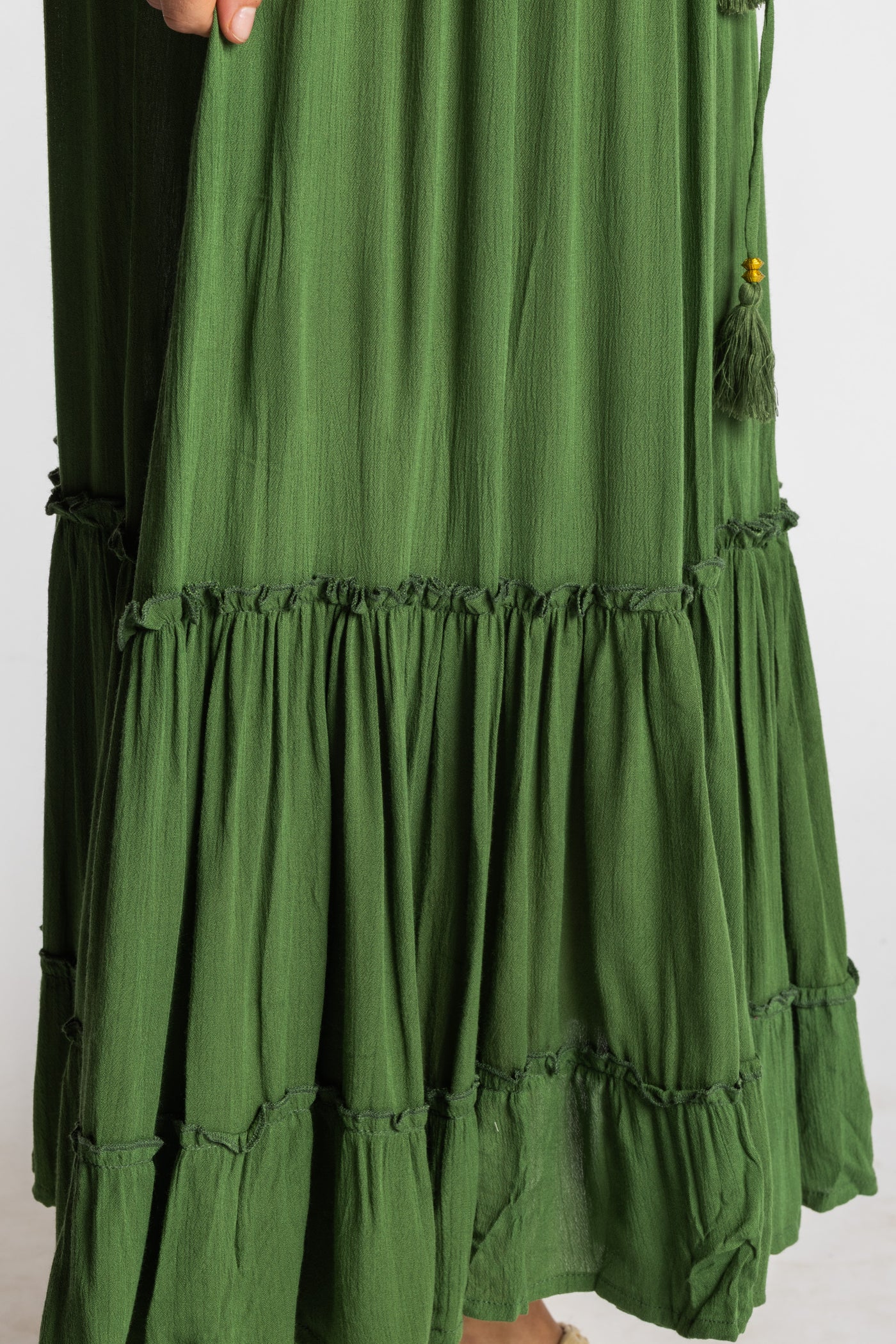 Sophie is wearing the Breezy Bliss Boho Prairie Skirt in green Fern