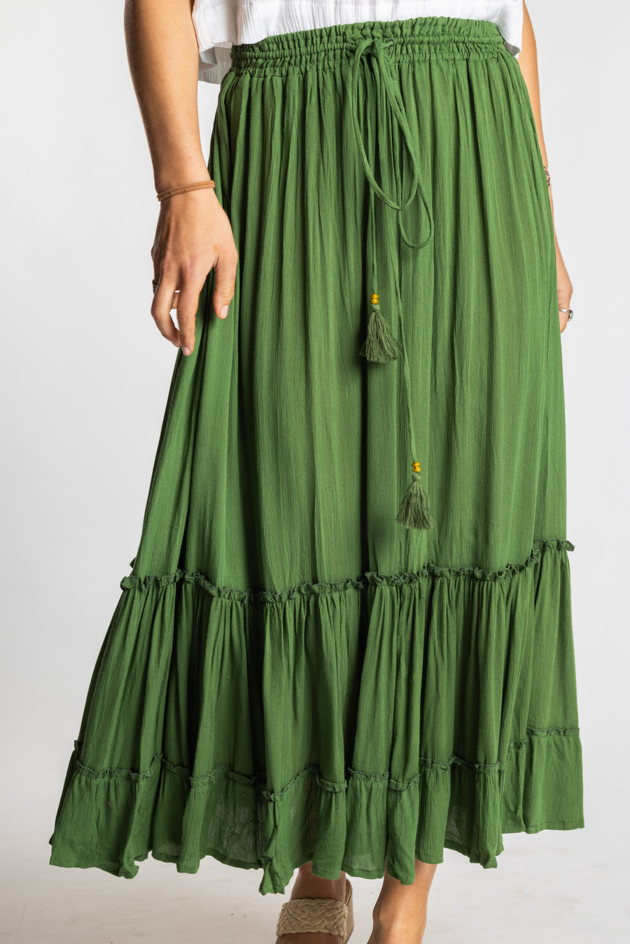 Sophie is wearing the Breezy Bliss Boho Prairie Skirt in green Fern