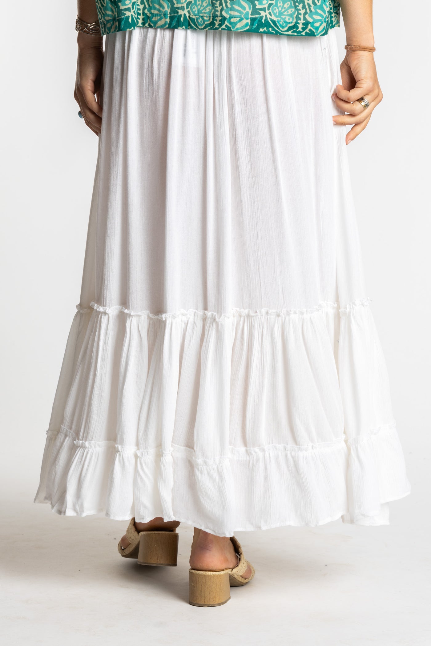 Sophie is wearing the Breezy Bliss Boho Prairie Skirt in white ivory