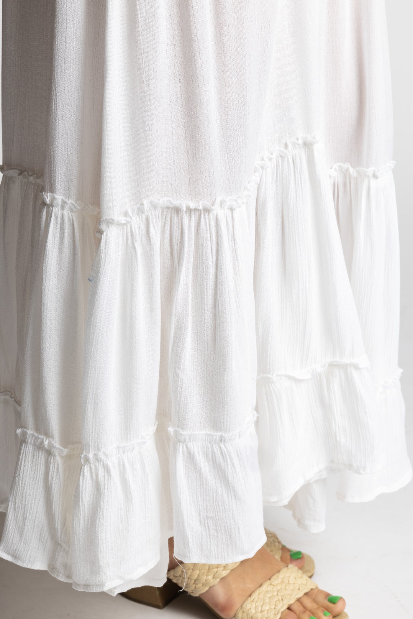 Sophie is wearing the Breezy Bliss Boho Prairie Skirt in white ivory