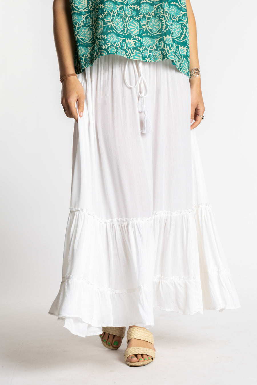 Sophie is wearing the Breezy Bliss Boho Prairie Skirt in white ivory