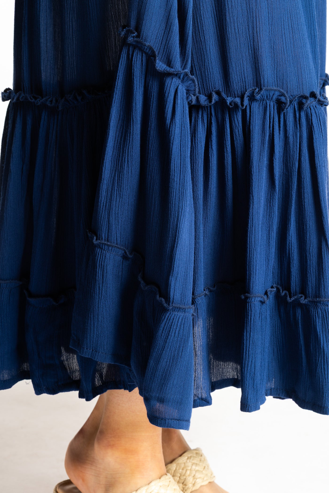 Sophie is wearing the Breezy Bliss Boho Prairie Skirt in blue navy
