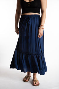 Sophie is wearing the Breezy Bliss Boho Prairie Skirt in blue navy