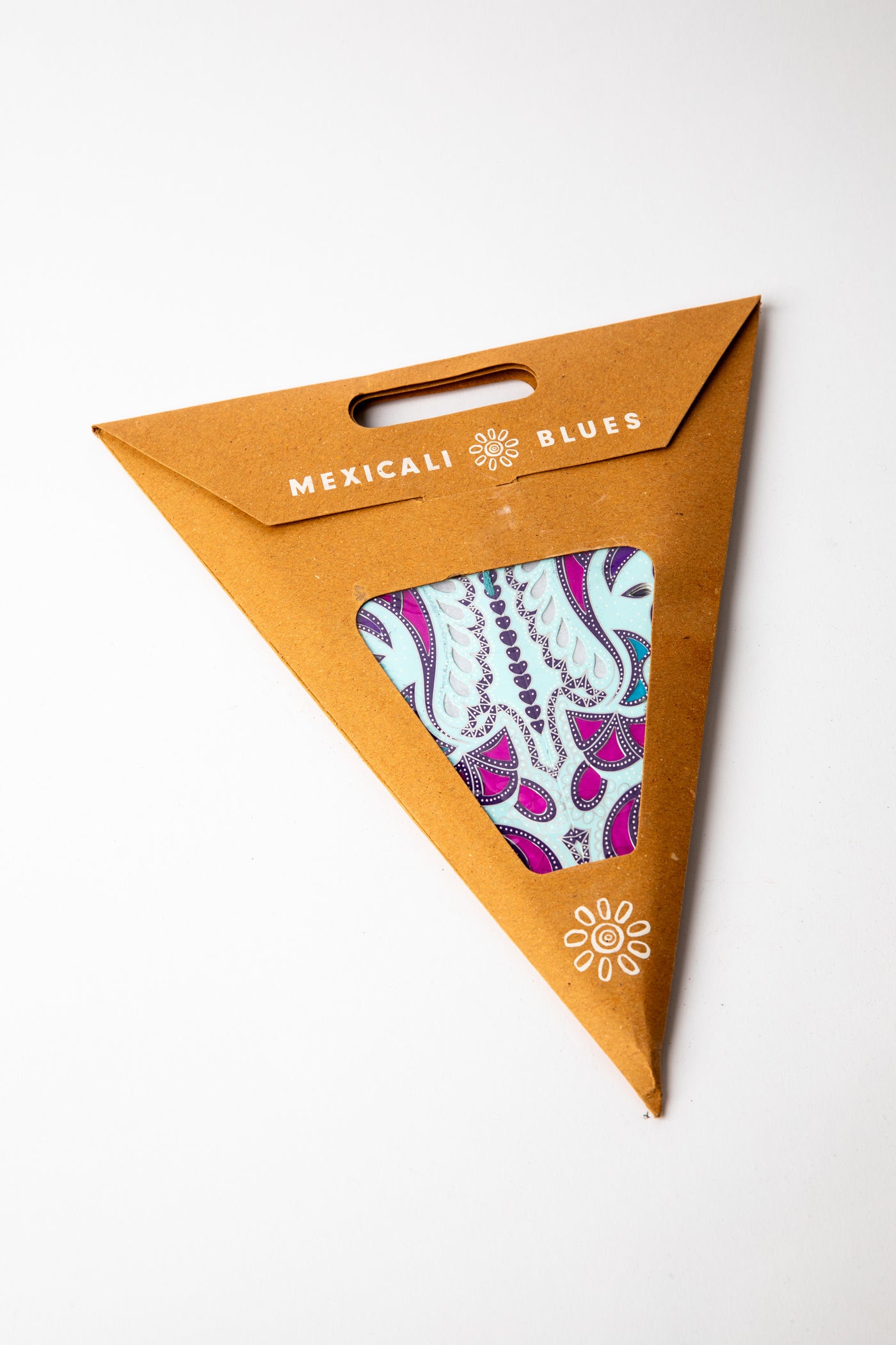 Lavender embroidered paper star, folded up, in packaging