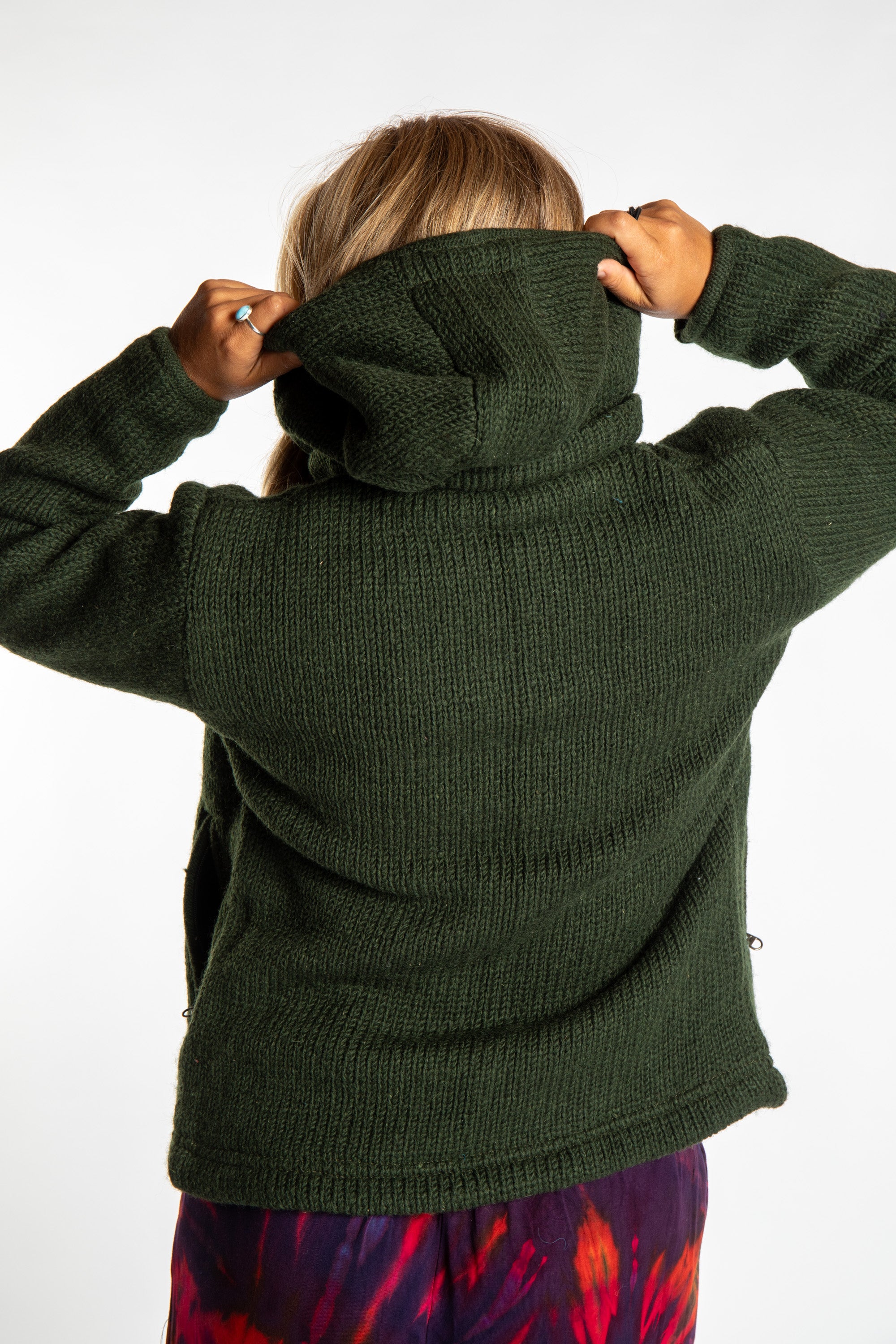 detail of hood on dark green wool hooded jacket