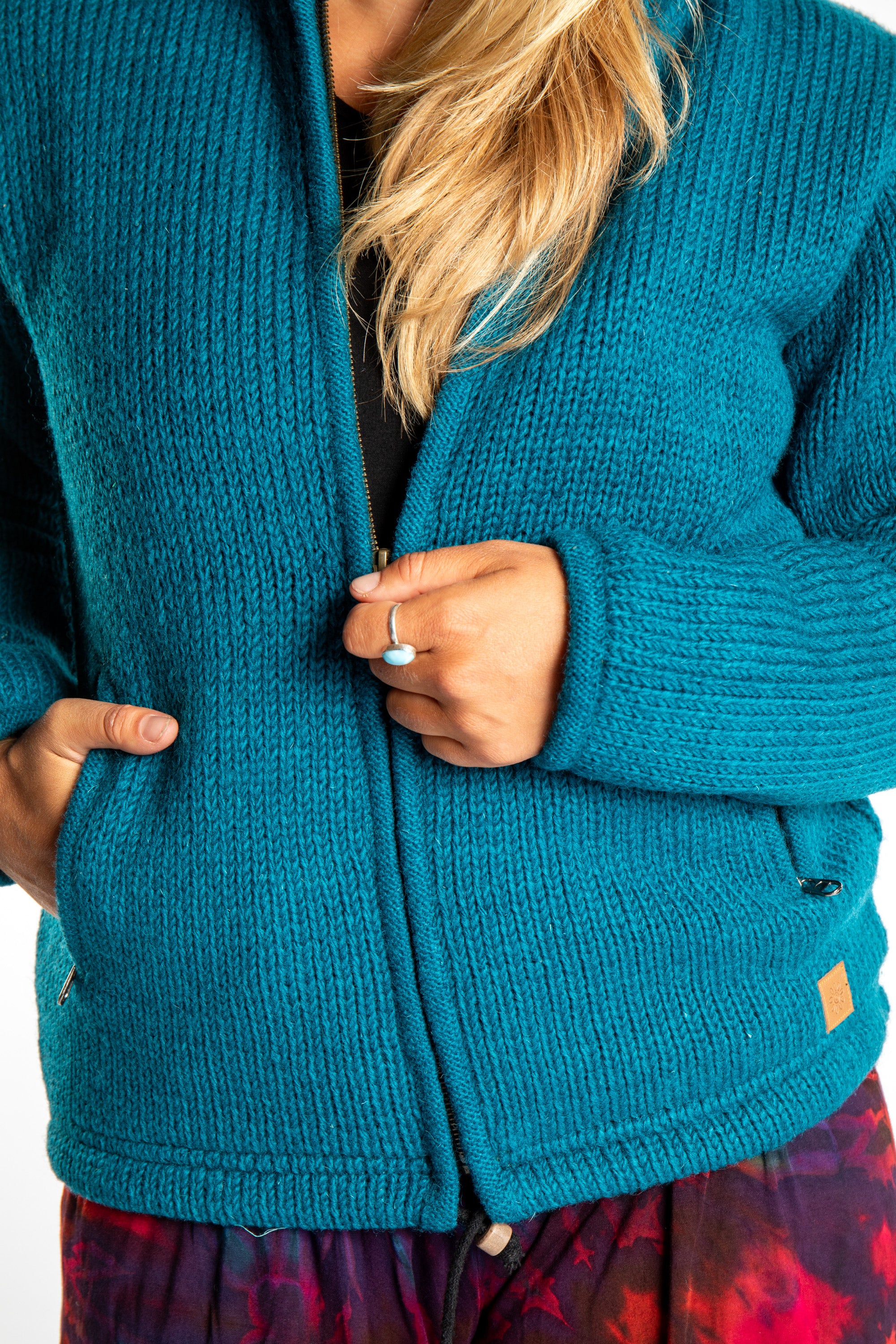 Detail of zipper on Teal wool hoodie jacket